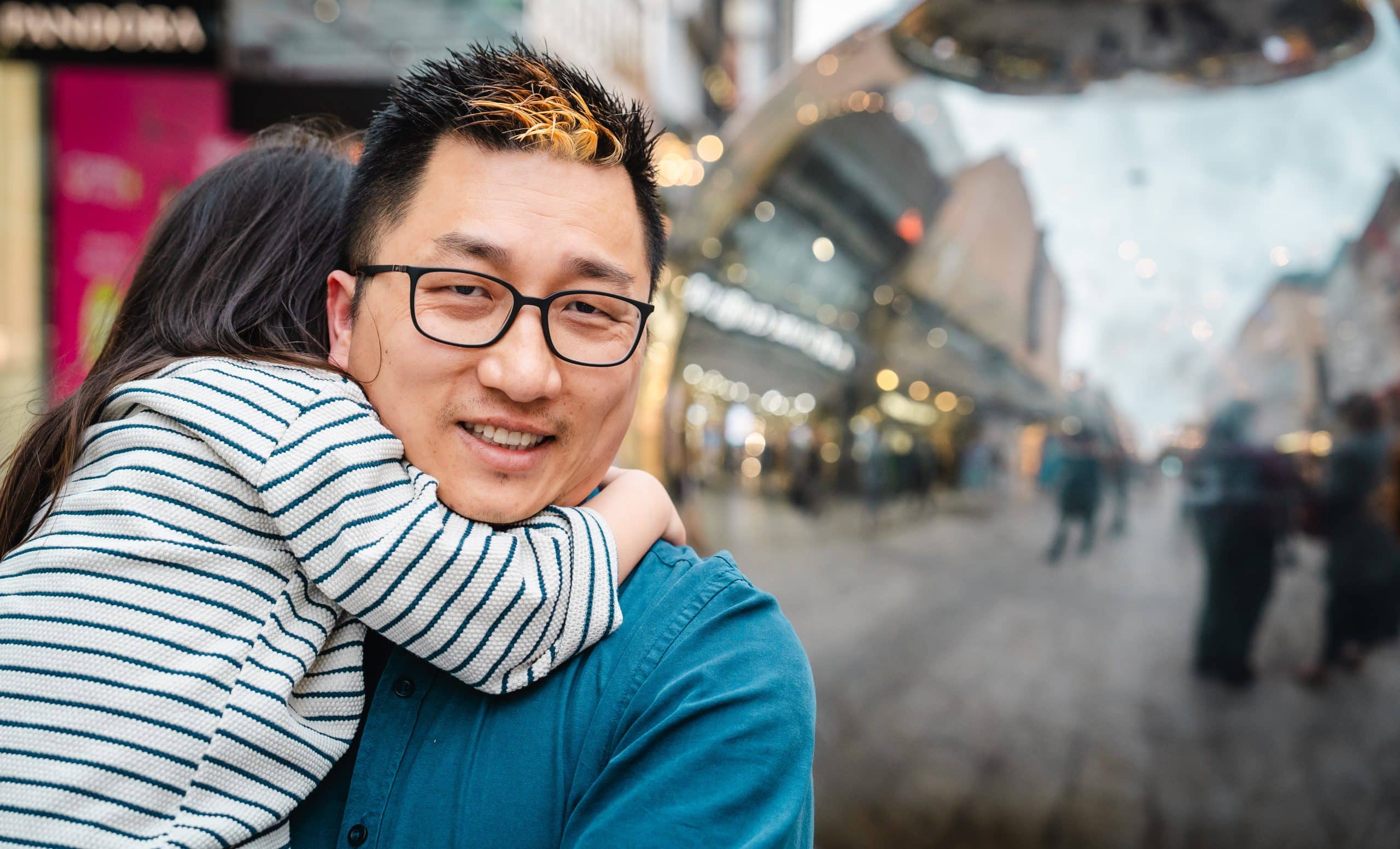 A father holding his young daughter